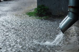 Rain water running away from home through gutter