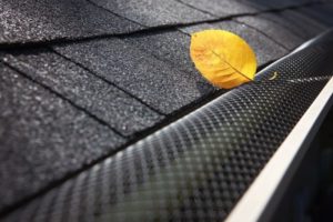 gutter guards placed over gutters on a home