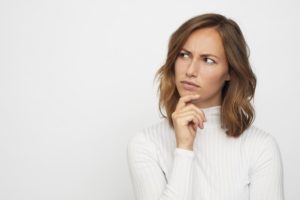 woman asking questions to choose the right company for gutter replacement