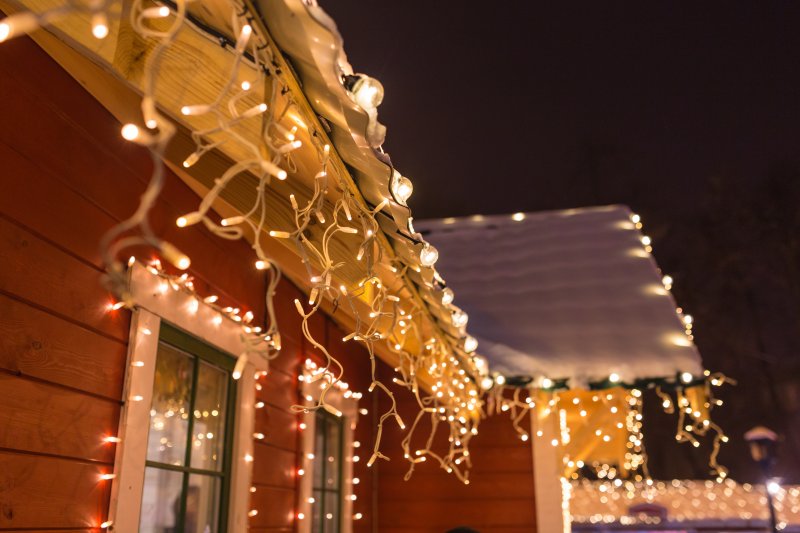 Christmas lights hanging on gutters