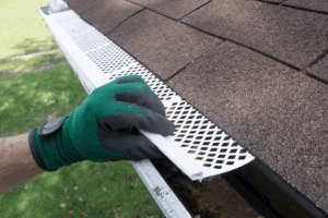 a person installing gutter guards