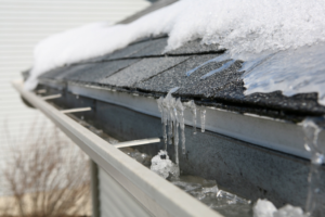 a close-up of a house with gutter guards during winter